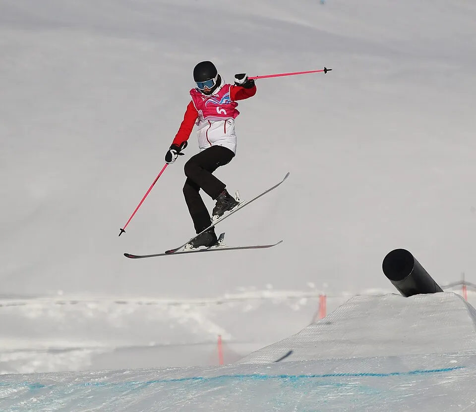 Eileen Gu competing in the halfpipe during freestyle skiing competition